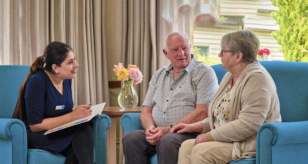Bupa-manager-with-two-people-discussing-aged-care-services-for-their-care
